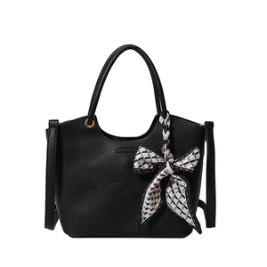 Fashionable black pebbled leather bucket bag with geometric silk scarf and gold hardware