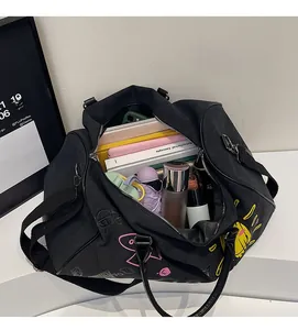 Detail view of the large capacity travel bag interior with colorful cartoon prints