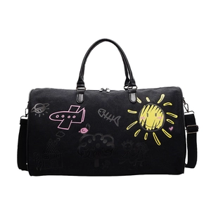 Large black canvas travel bag featuring colorful cartoon graffiti and sun patterns