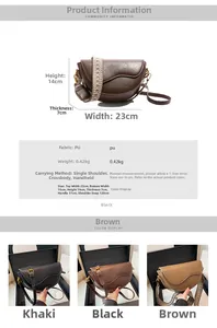 Detailed view of women saddle bag with bohemian embroidered strap and PU leather texture