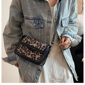 Fashionable leopard print flap crossbody bag styled with a casual denim outfit for women