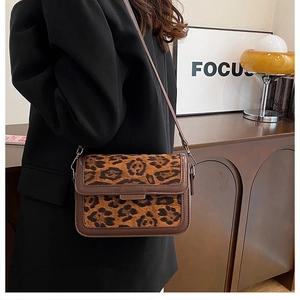 Retro brown leopard print crossbody bag styled in a cozy indoor setting for lifestyle look