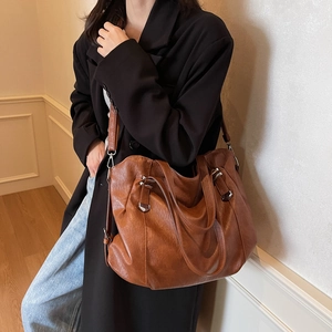 Fashionable retro brown leather tote bag with silver hardware for women's daily commute