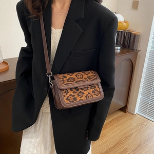 Vintage leopard print crossbody square bag with brown leather trim and adjustable strap