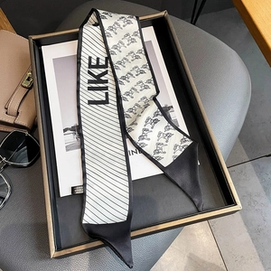 Fashionable twilly scarf featuring striped pattern and pony print in black and white