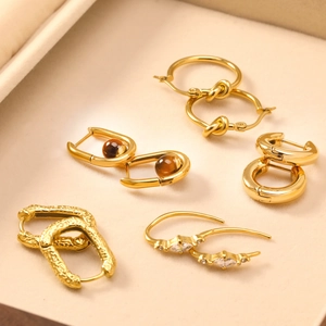 Minimalist gold geometric earring set with hammered texture and rhinestone accents