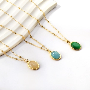 Collane in titanio con ciondoli ovali in pietre preziose champagne, azzurro e verde smeraldo
