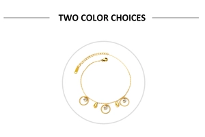Detailed shot of a gold anklet featuring circle charms and drop pendants with lobster clasp