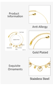 Detailed view of gold-plated stainless steel anklet with cubic zirconia charms and droplet pendants