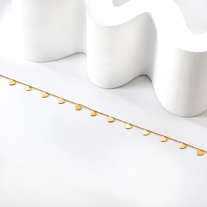 Minimalist 18K gold plated stainless steel anklet featuring multiple heart charms on white