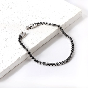Elegantes Tennisarmband aus Edelstahl mit schwarzen runden Zirkonia-Steinen besetzt