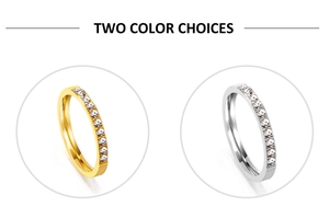Detail view of gold and silver stackable rings with sparkling zircon pavé setting