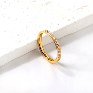 Elegant gold-plated stainless steel eternity ring with cubic zirconia stones on stone base