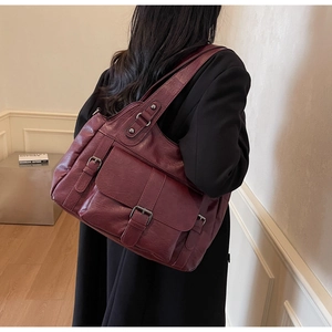 Deep red vintage faux leather tote bag shown on model for daily commuting style