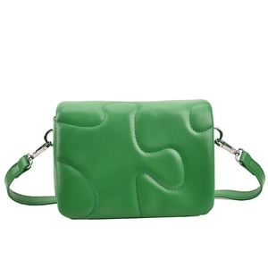 Chic vibrant green crossbody flap bag with modern geometric stitching and silver hardware