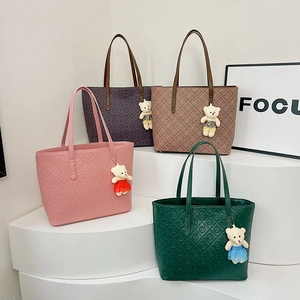 Minimalist vintage tote bags with letter embossing and plush bear charms in four colors