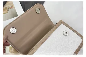 Detail of premium lychee texture leather shoulder bag with double magnetic buckle closure