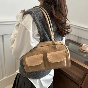 Beige crocodile texture shoulder bag with front pockets and elegant vintage design