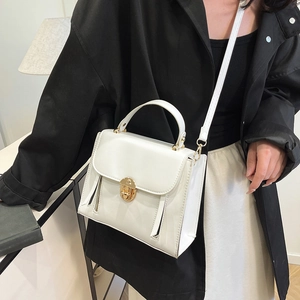 Classic white leatherette crossbody handbag with elegant gold twist lock hardware for women