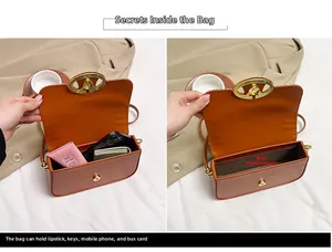 Detail of a brown leather box bag showing spacious interior for phone and cosmetics