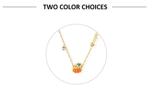 Detail of gold pumpkin pendant with orange enamel and crystal accents on a thin chain