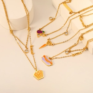Golden stainless steel necklaces with colorful enamel food charms like pizza and carrot