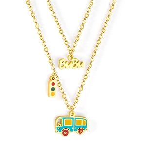 Golden necklace with BiBi letter, traffic light, and cute bus pendants on white background