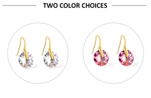 Detail of round crystal hook earrings in white and pink with golden metal finish