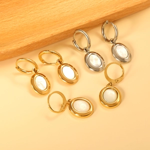 Chic gold and silver hoop earrings featuring elegant oval mother of pearl shell pendants