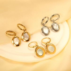 Three pairs of oval shell drop hoop earrings in gold and silver finish on silk