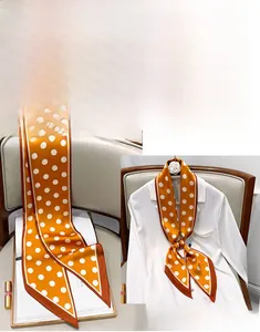 Polka dot silk scarf in bright yellow with brown borders used as a stylish neck tie