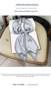 Detail of light blue silk-like skinny scarf with houndstooth edge, size 15x150cm