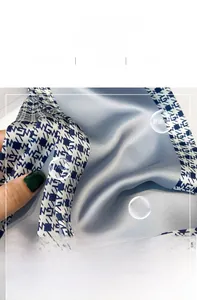 Detailed view of silk scarf fabric showing high-quality inner stitching and patterns