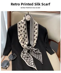 Close-up of retro houndstooth silk scarf tied on a neck for an elegant fashion style