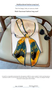 Detail of 15x150cm faux silk scarf with oil painting pattern placed on an open book