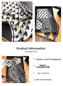 Détail macro de l'écharpe en soie à motif pied-de-poule noir et blanc avec couture interne