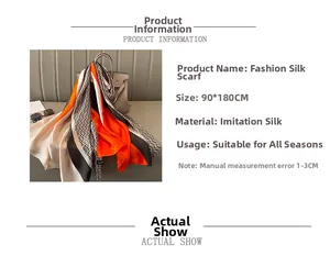 Close-up of geometric pattern silk shawl measuring 90x180cm in orange and black