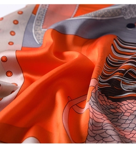 Macro shot of printed silk scarf fabric with elegant satin sheen and colorful patterns