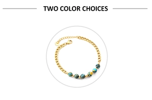 Detail of gold-plated chain bracelet with blue and yellow striped natural stone beads