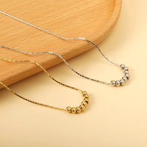 Minimalist stainless steel necklaces with polished bead pendants in gold and silver finish