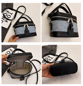 Detailed views of color-block barrel bag with blue denim and black leather stitching