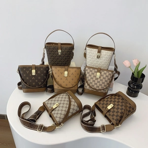 Elegant bucket bags with retro pattern prints, featuring top handles and wide crossbody straps