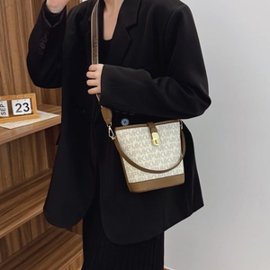 Fashionable monogram bucket bag for women with white printed leather and brown strap