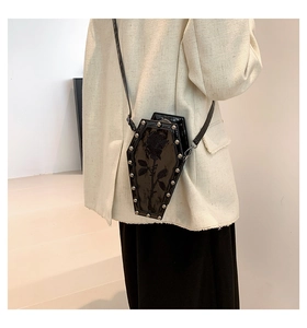 Gothic coffin-shaped crossbody bag featuring rose prints and silver metallic rivets