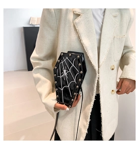 Gothic coffin-shaped crossbody bag with spider web pattern and silver metallic studs