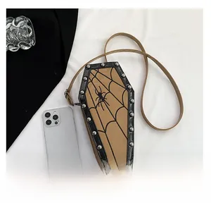 Detail of gothic coffin crossbody bag with spider web pattern and silver studs