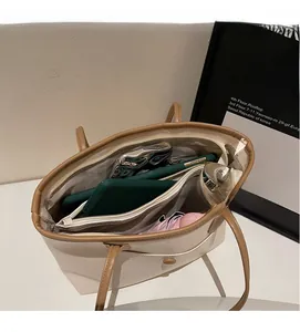 Top view showing spacious interior compartments of the large two-tone tote bag