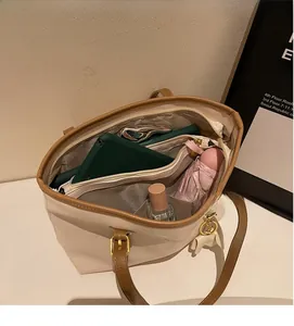 Interior view of vintage PU tote bag showing large capacity and multi-layer storage compartments