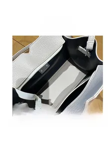 Macro view of interior layout with zipper pocket and detachable strap for leather handbag