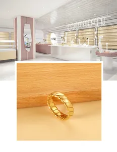 Detail of 18K gold-plated croissant ring featuring a vintage twisted spiral design